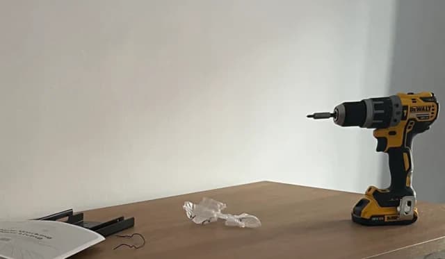 The newly assembled workshop desk with a drill on top